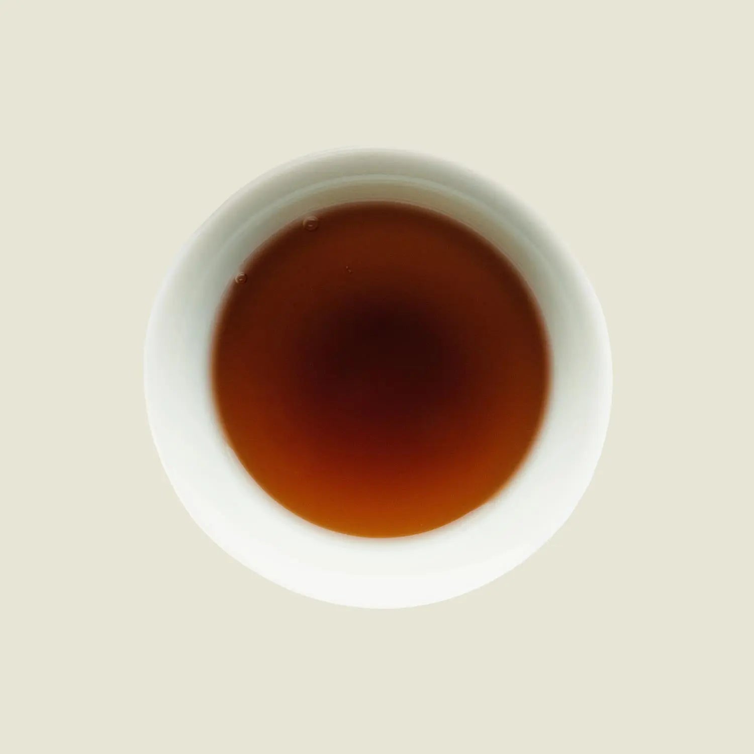 Darjeeling Grey - Noema - Tassenfarbe dunkles orange braun von oben fotografiert