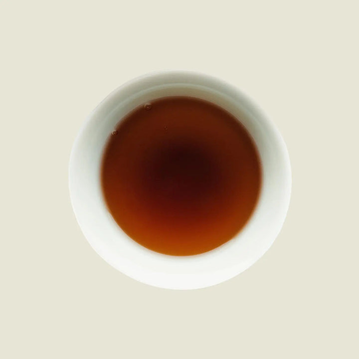 Darjeeling Grey - Noema - Tassenfarbe dunkles orange braun von oben fotografiert